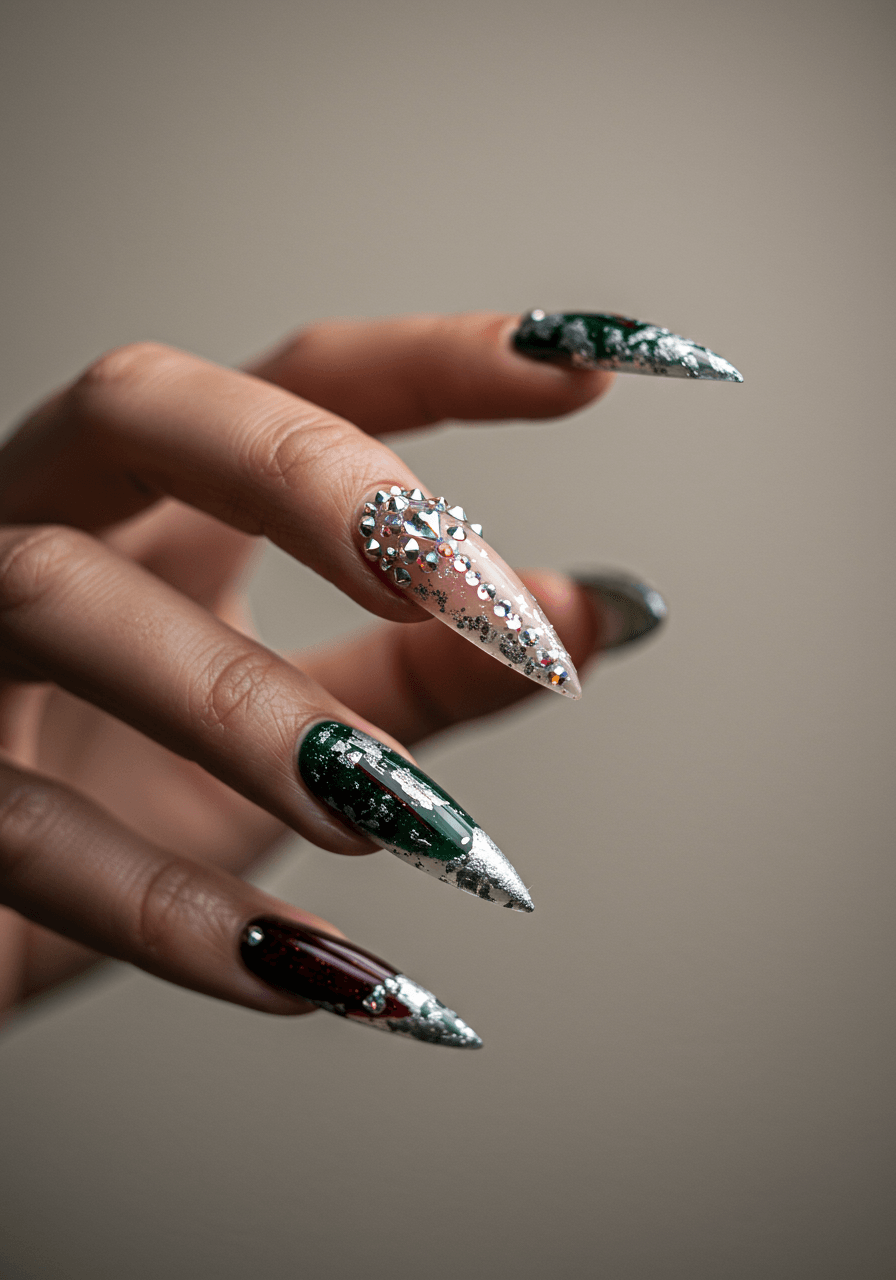 Sharp stiletto nails with diamond-encrusted tips and burgundy-green Christmas accents
